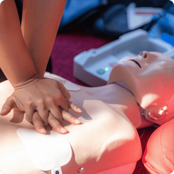 CPR training on a manikin with AED.